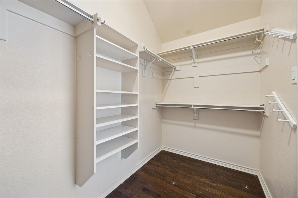 676 Scenic Ranch Circle Fairview, TX 75069 - Photo 17 of 30 a view of walk in closet with empty racks