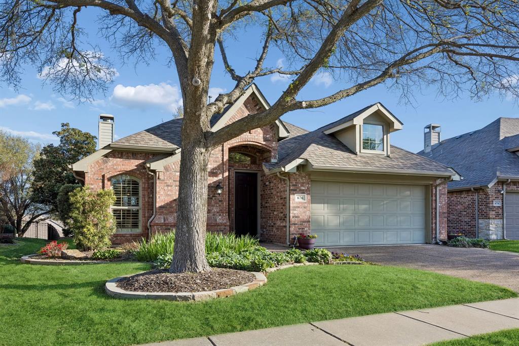 676 Scenic Ranch Circle Fairview, TX 75069 - Photo 2 of 30 a front view of a house with garden