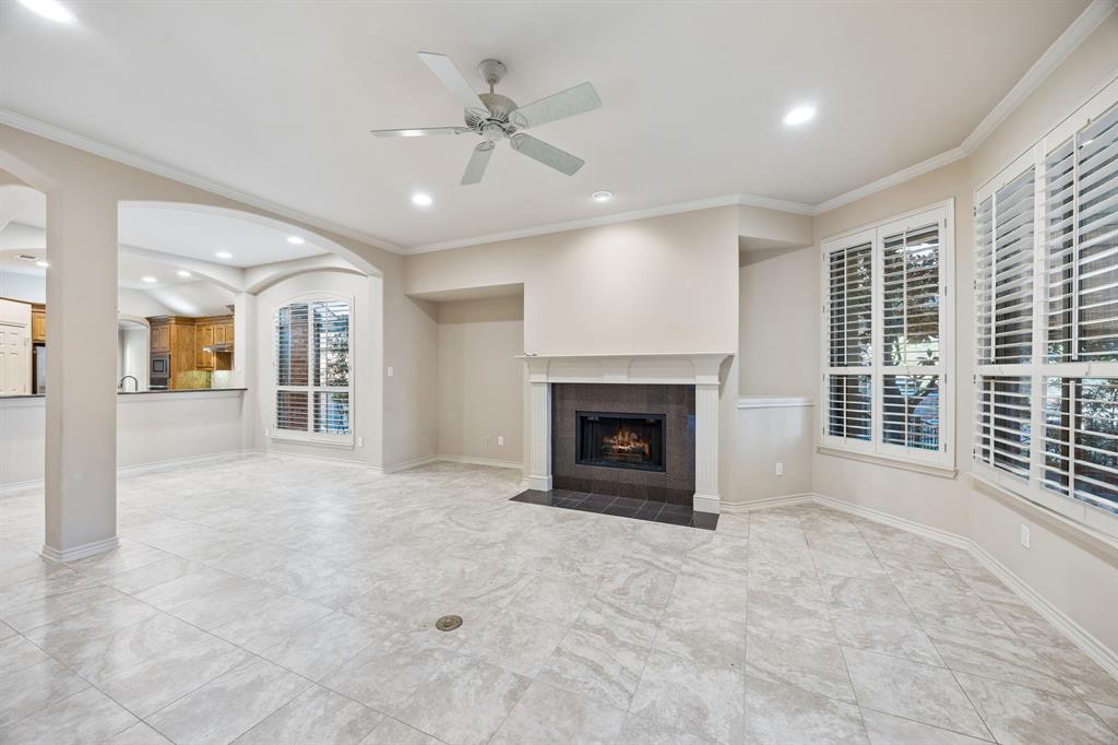 676 Scenic Ranch Circle Fairview, TX 75069 - Photo 9 of 30 a view of an empty room with a fireplace and a window