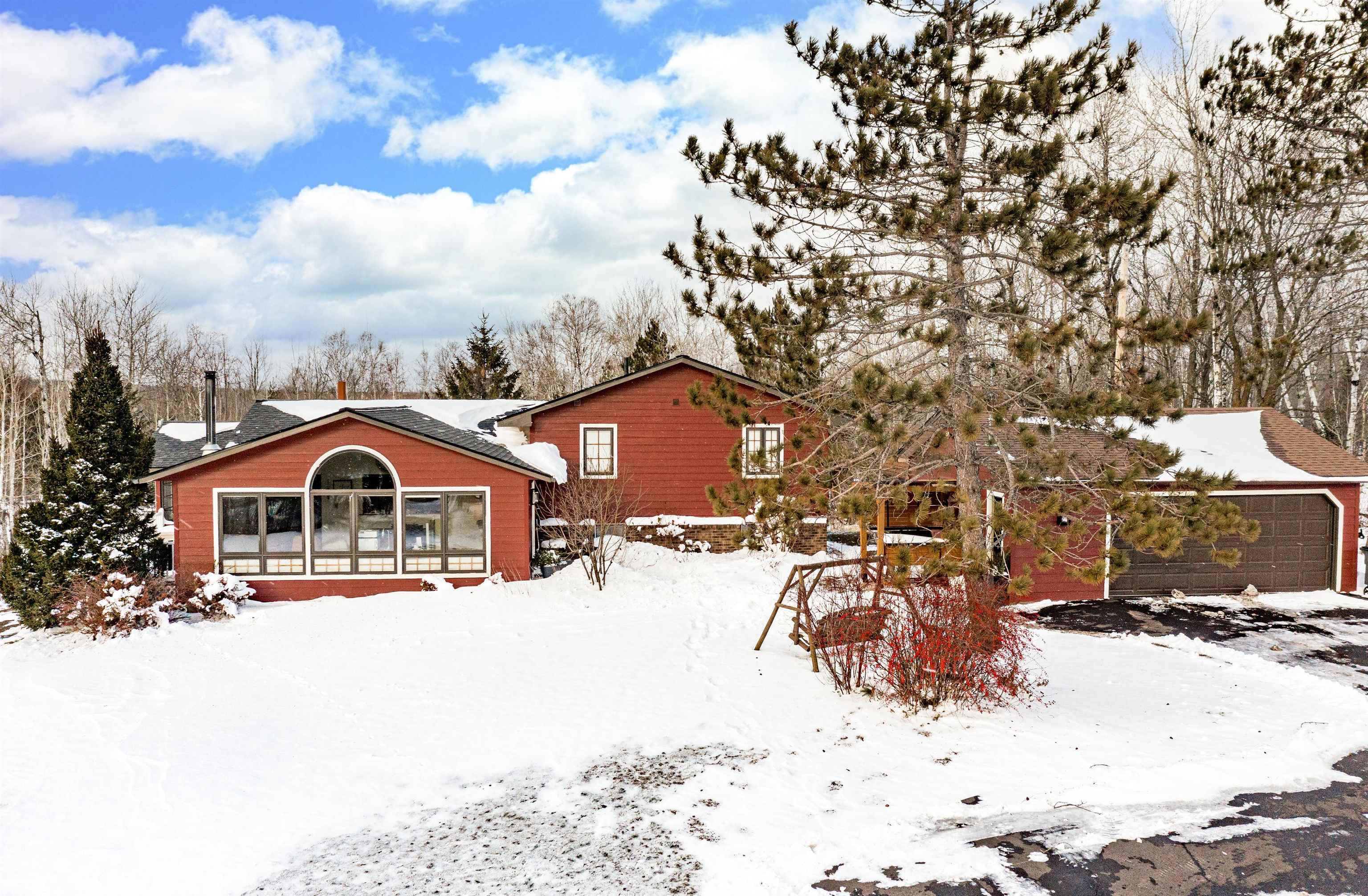 Nestled into a beautiful 10 acre setting of Lakewood Township.