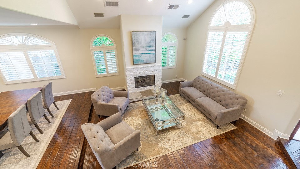 4461 Stern Avenue Sherman Oaks, CA 91423 - Photo 13 of 62 a living room with furniture fireplace and a large window