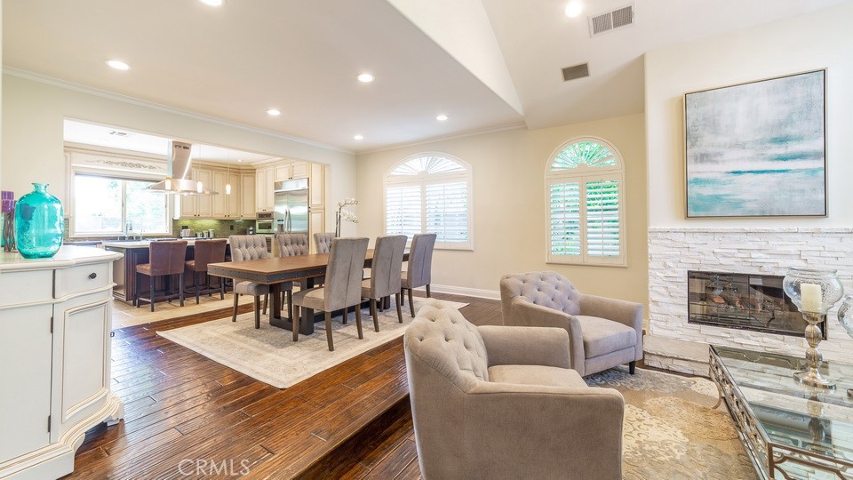 4461 Stern Avenue Sherman Oaks, CA 91423 - Photo 16 of 62 a living room with furniture a fireplace and a large window