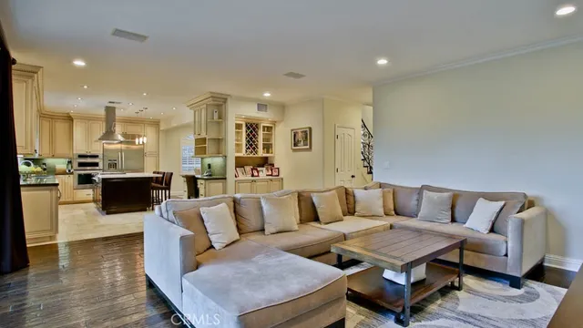 a kitchen with stainless steel appliances granite countertop a sink and cabinets