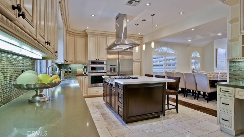 4461 Stern Avenue Sherman Oaks, CA 91423 - Photo 24 of 62 a kitchen with stainless steel appliances granite countertop a sink a stove and a wooden floors