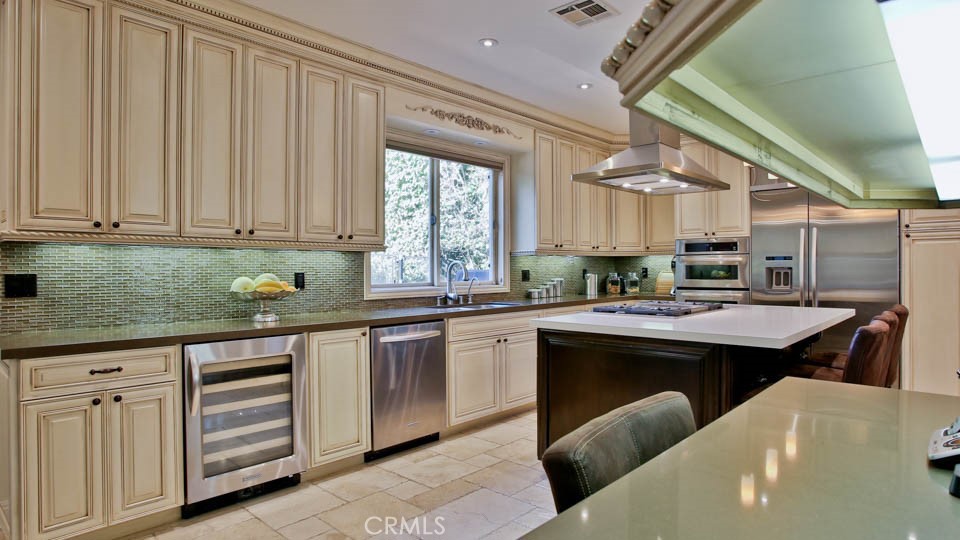 4461 Stern Avenue Sherman Oaks, CA 91423 - Photo 25 of 62 a kitchen with stainless steel appliances granite countertop a sink and cabinets