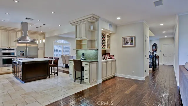 a spacious bedroom with a bed and a wooden floor