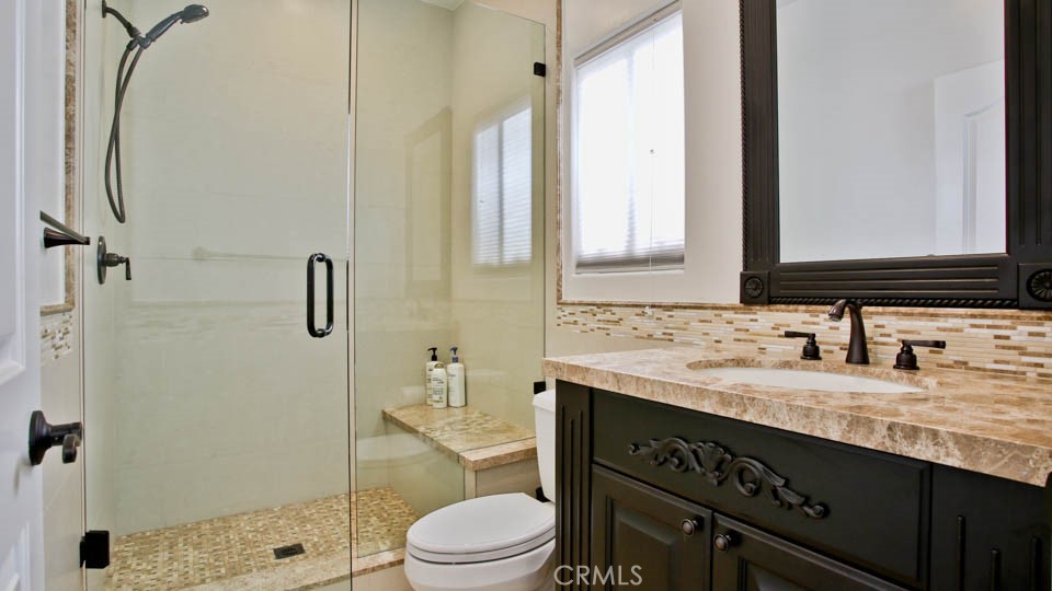4461 Stern Avenue Sherman Oaks, CA 91423 - Photo 32 of 62 a bathroom with a granite countertop sink toilet and shower