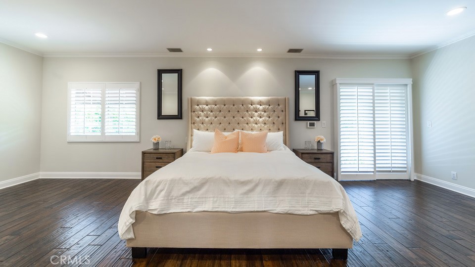 4461 Stern Avenue Sherman Oaks, CA 91423 - Photo 36 of 62 a large bed sitting in a spacious bedroom next to a window