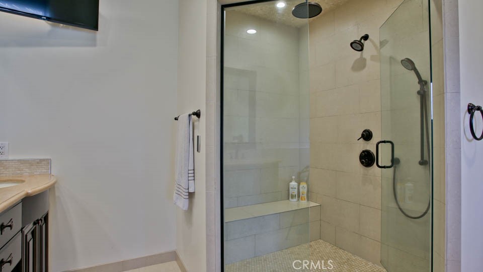 4461 Stern Avenue Sherman Oaks, CA 91423 - Photo 45 of 62 a bathroom with a glass shower door