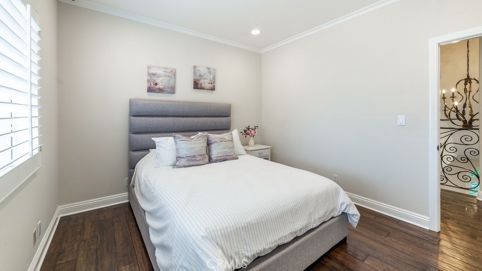 4461 Stern Avenue Sherman Oaks, CA 91423 - Photo 55 of 62 a bedroom with a bed and wooden floor