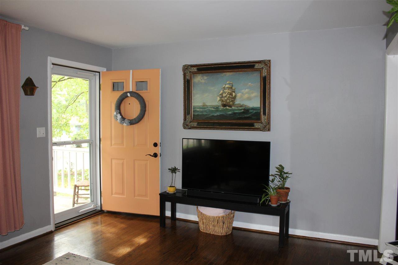 904 Chatham Lane Raleigh, NC 27610 - Photo 14 of 29 a living room with furniture and a fireplace
