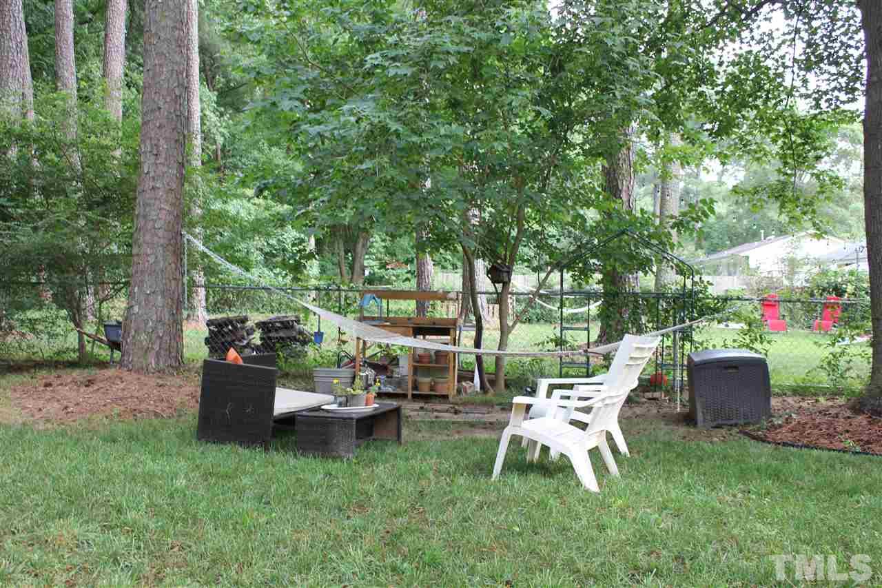 904 Chatham Lane Raleigh, NC 27610 - Photo 15 of 29 a view of a chair and tables in the garden