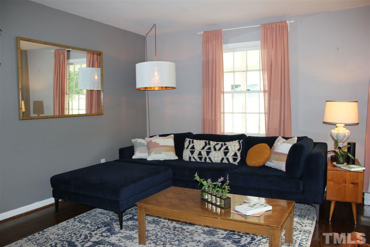 904 Chatham Lane Raleigh, NC 27610 - Photo 20 of 29 a living room with furniture a rug and a lamp
