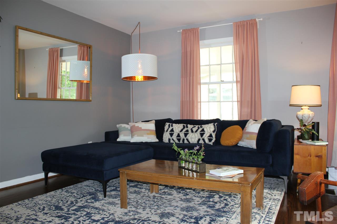904 Chatham Lane Raleigh, NC 27610 - Photo 3 of 29 a living room with furniture potted plant and wooden floor