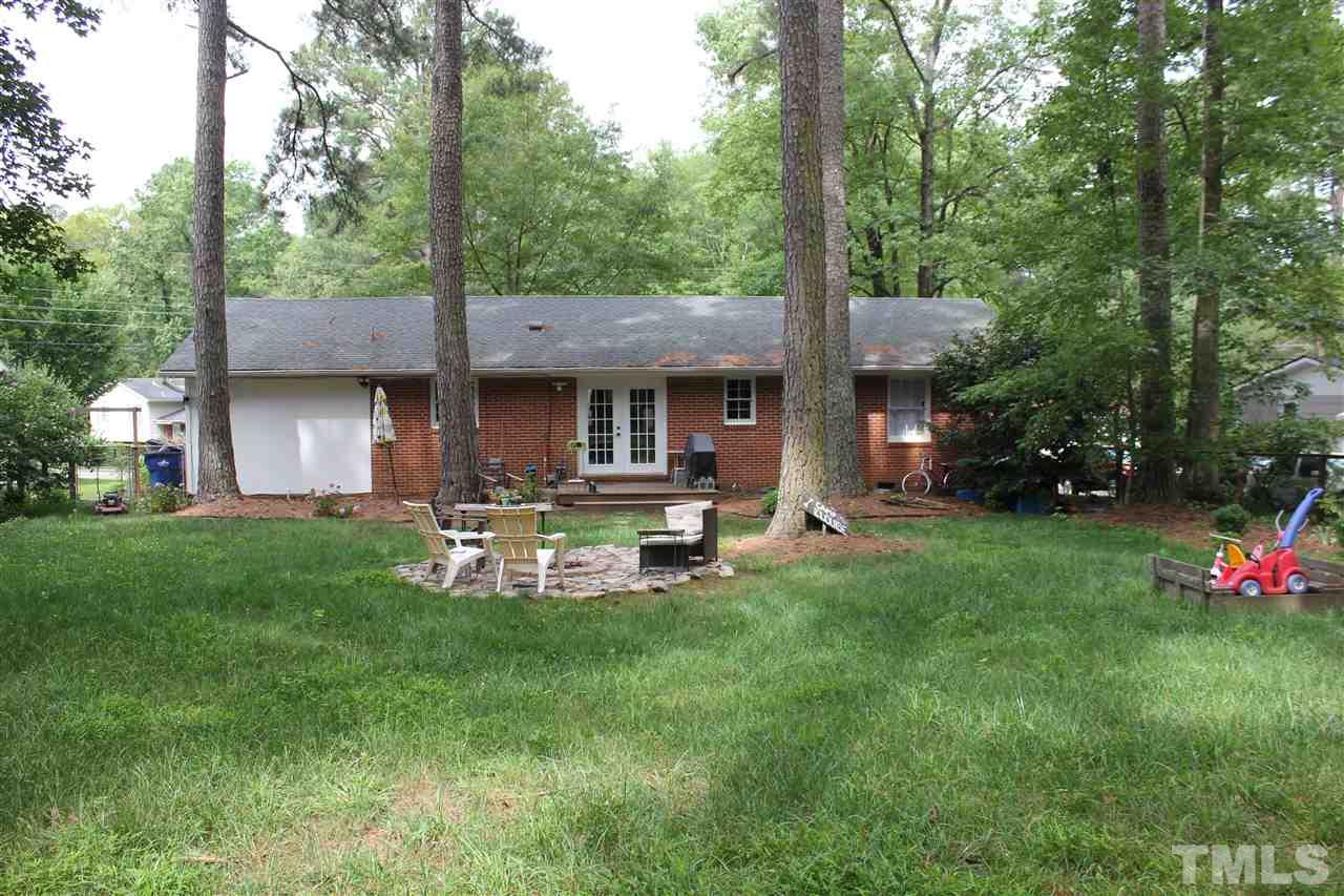 904 Chatham Lane Raleigh, NC 27610 - Photo 23 of 29 a view of a chairs and table in backyard of the house