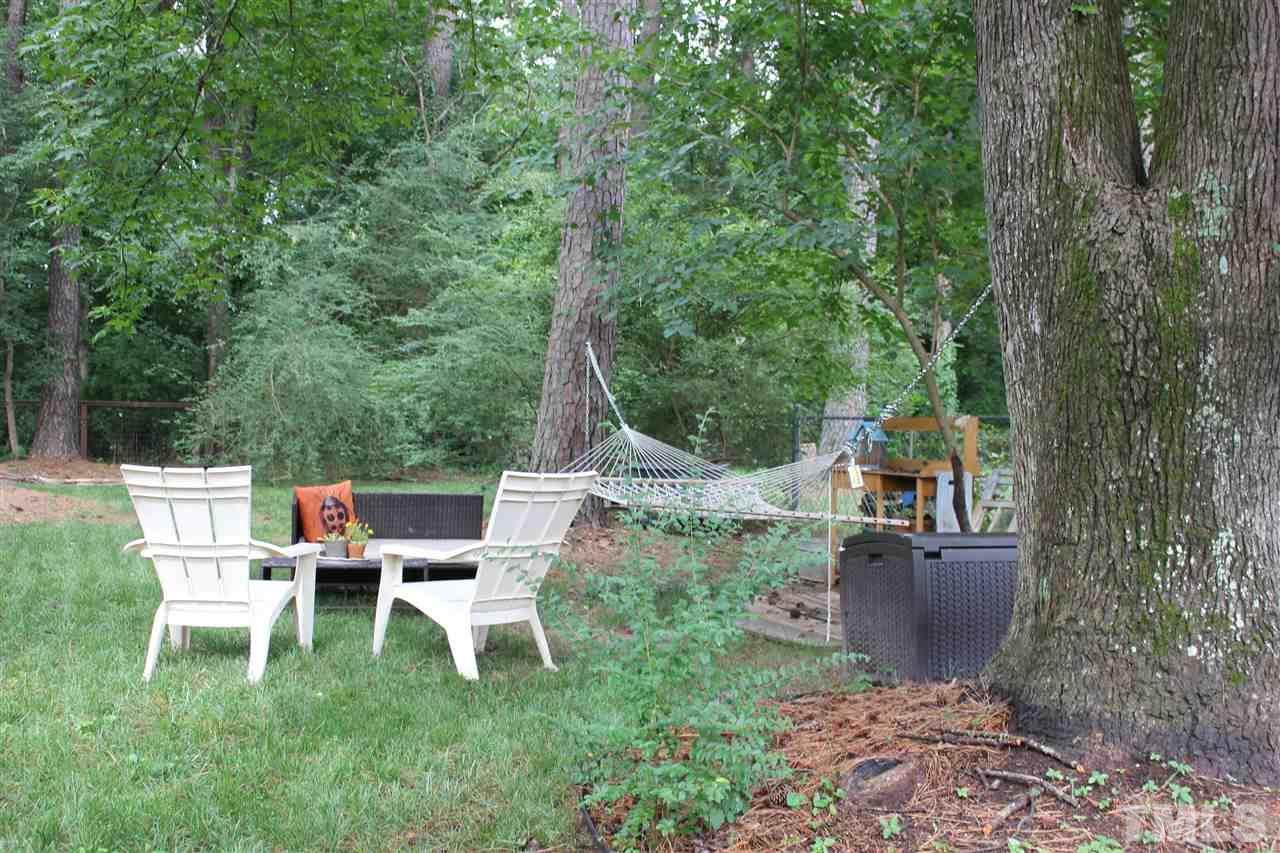 904 Chatham Lane Raleigh, NC 27610 - Photo 29 of 29 a view of a chair and tables in the back yard