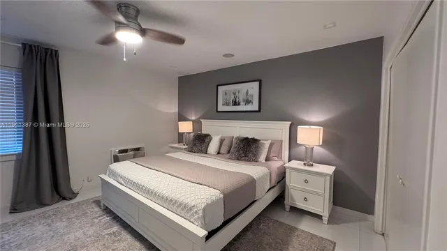a bed room with a bed and a night stand