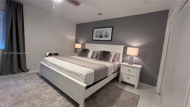 a bathroom with a sink toilet and a mirror