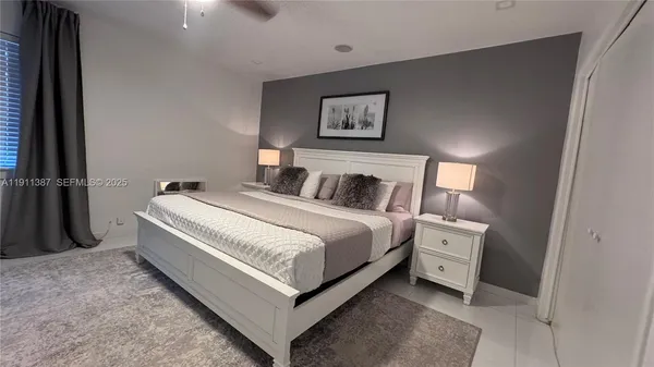 a bathroom with a sink toilet and a mirror