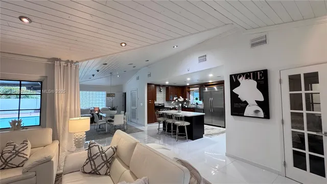 a living room with furniture and a clock