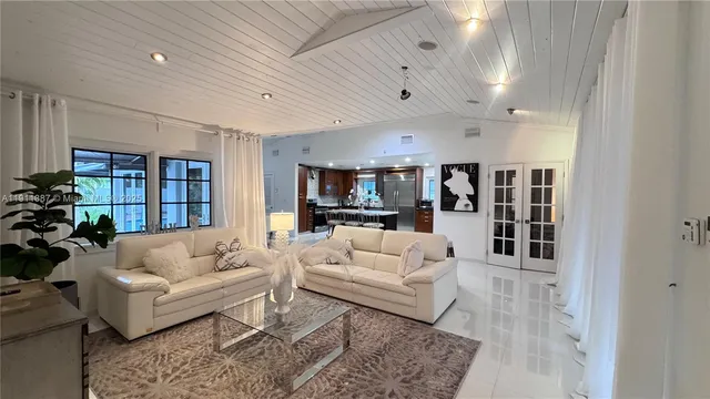 a kitchen with stainless steel appliances kitchen island granite countertop a sink and cabinets