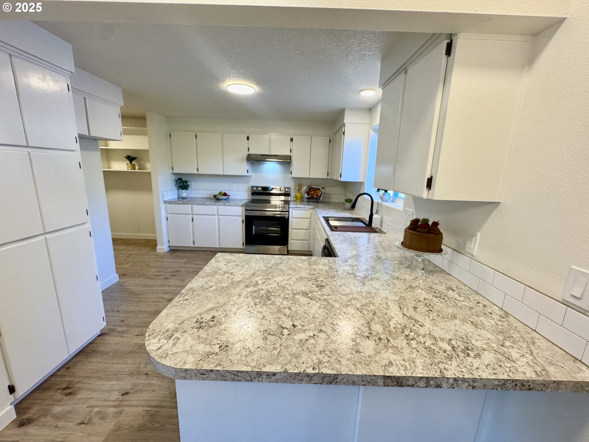 73345 Apiary Road Rainier, OR 97048 - Photo 11 of 44 a large kitchen with kitchen island sink stove and refrigerator
