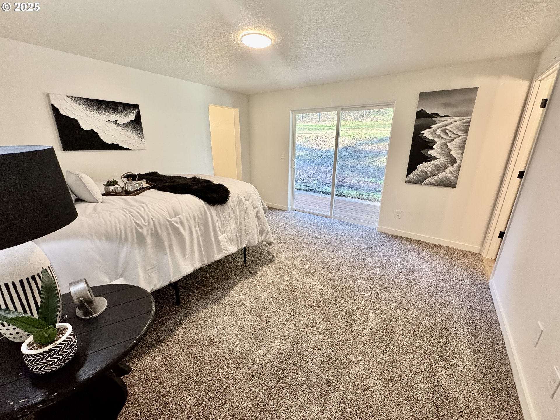 73345 Apiary Road Rainier, OR 97048 - Photo 15 of 44 a bed room with a bed and a couch