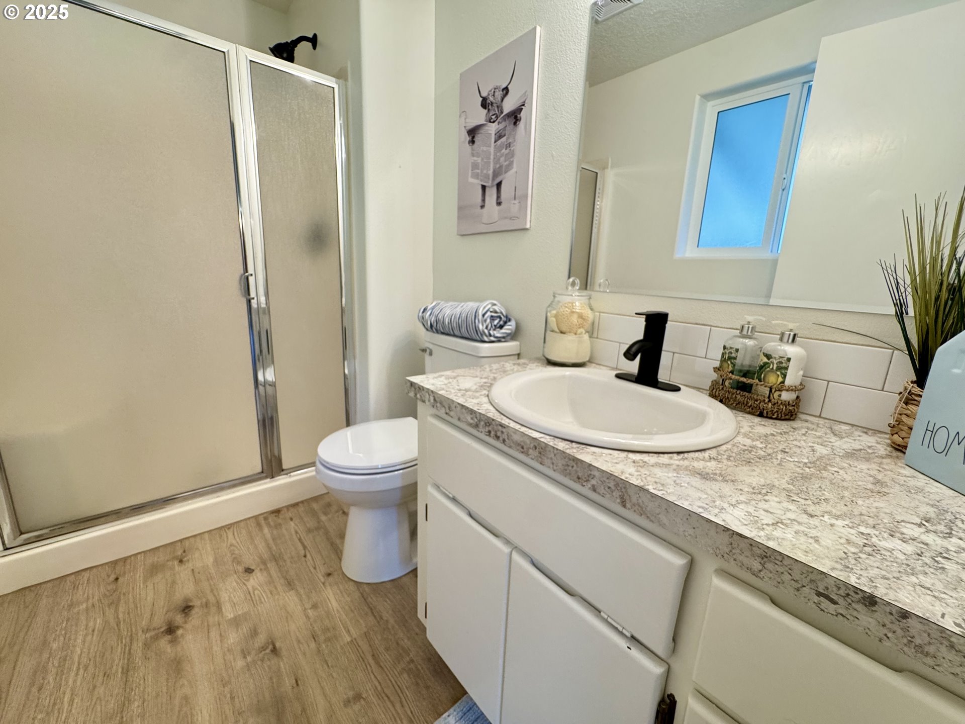 73345 Apiary Road Rainier, OR 97048 - Photo 18 of 44 a bathroom with a granite countertop sink toilet and shower