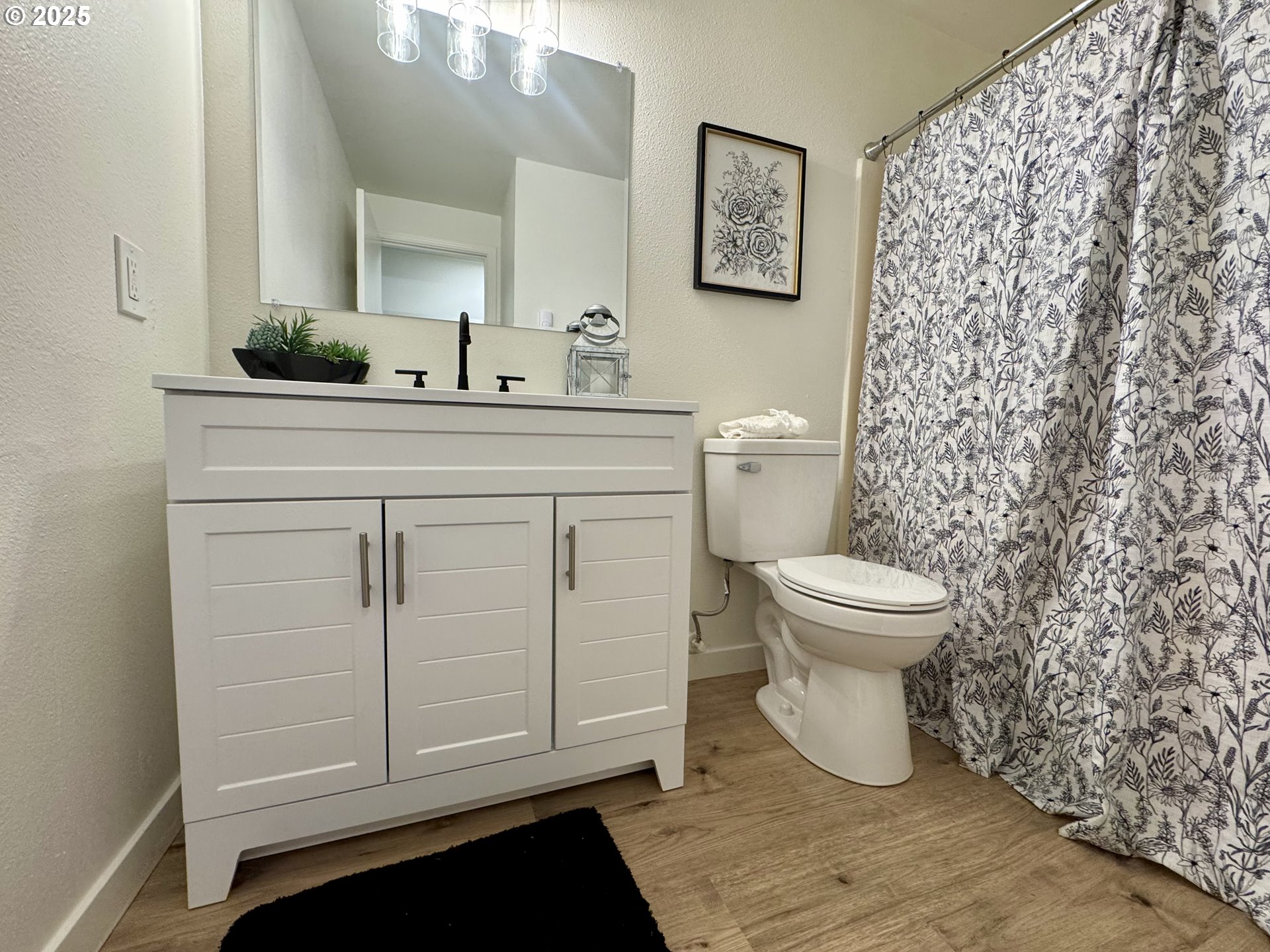 73345 Apiary Road Rainier, OR 97048 - Photo 23 of 44 a bathroom with a sink a toilet and a mirror