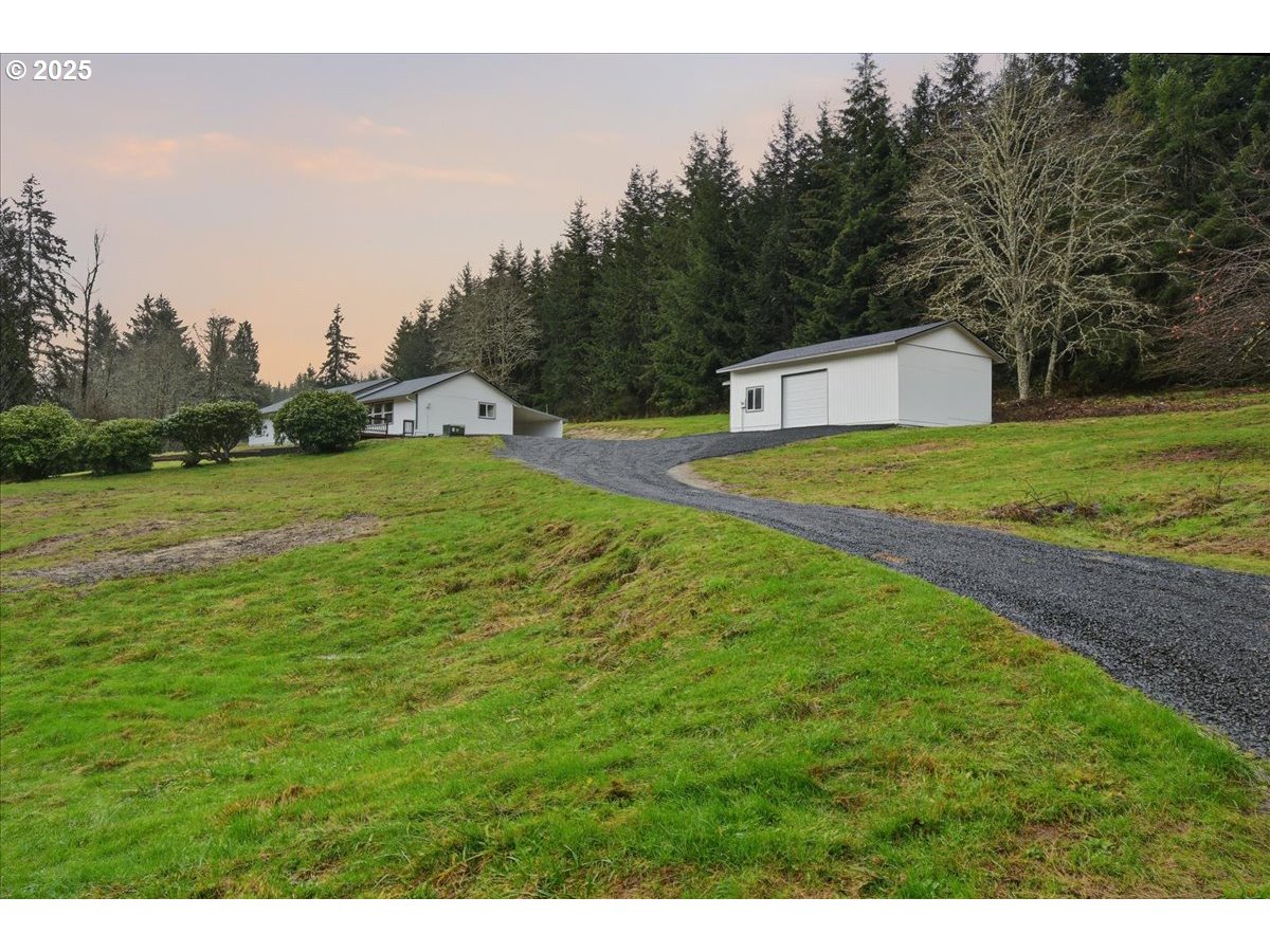 73345 Apiary Road Rainier, OR 97048 - Photo 40 of 44 a yellow and white house with a big yard