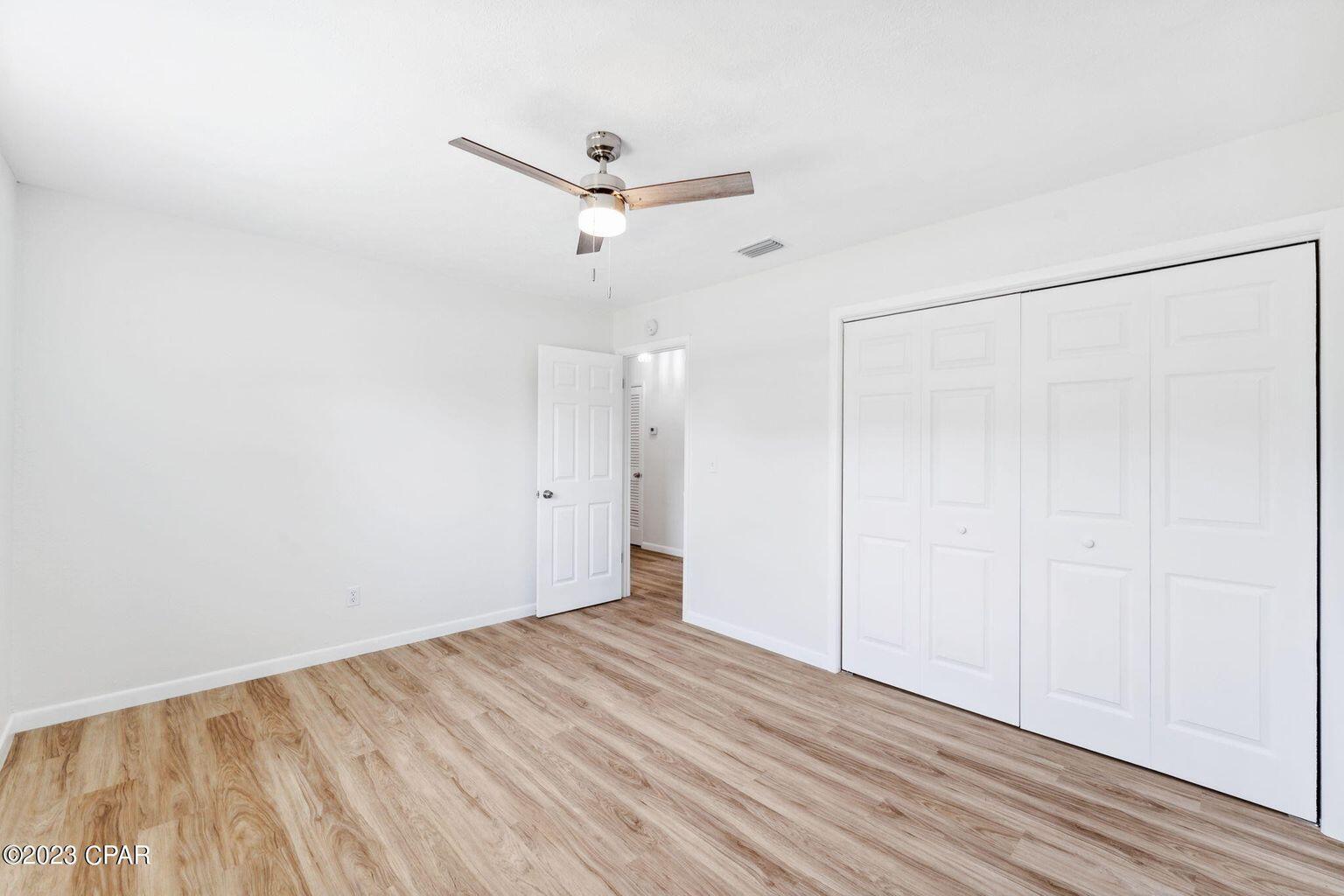 1029 Ethlyn Road Panama City, FL 32404 - Photo 19 of 29 an empty room with a empty space and a ceiling fan