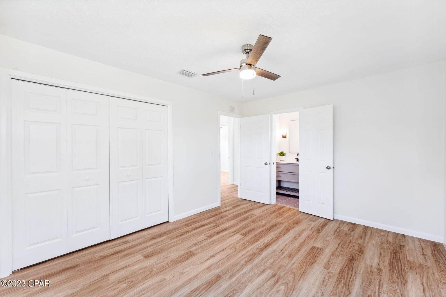 1029 Ethlyn Road Panama City, FL 32404 - Photo 21 of 29 a view of empty room with wooden floor and window