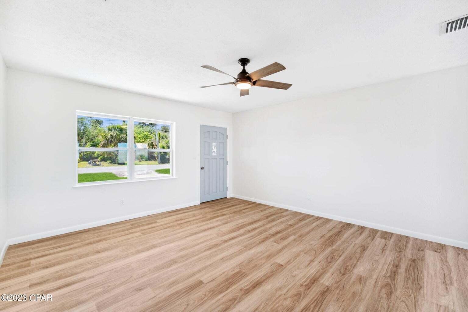 1029 Ethlyn Road Panama City, FL 32404 - Photo 4 of 29 a view of empty room with wooden floor and fan