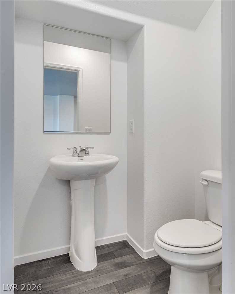 1114 Scarlet Sparrow Street Henderson, NV 89011 - Photo 13 of 25 A well-maintained lavatory provides functional elegance and essential comfort.