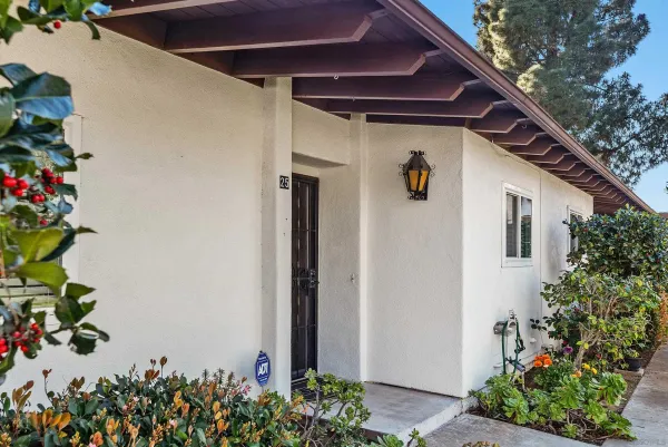a view of a house with a flower garden