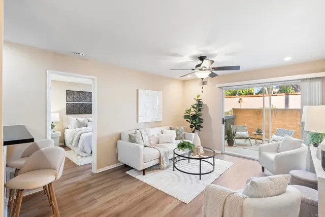 a living room with furniture and a large window
