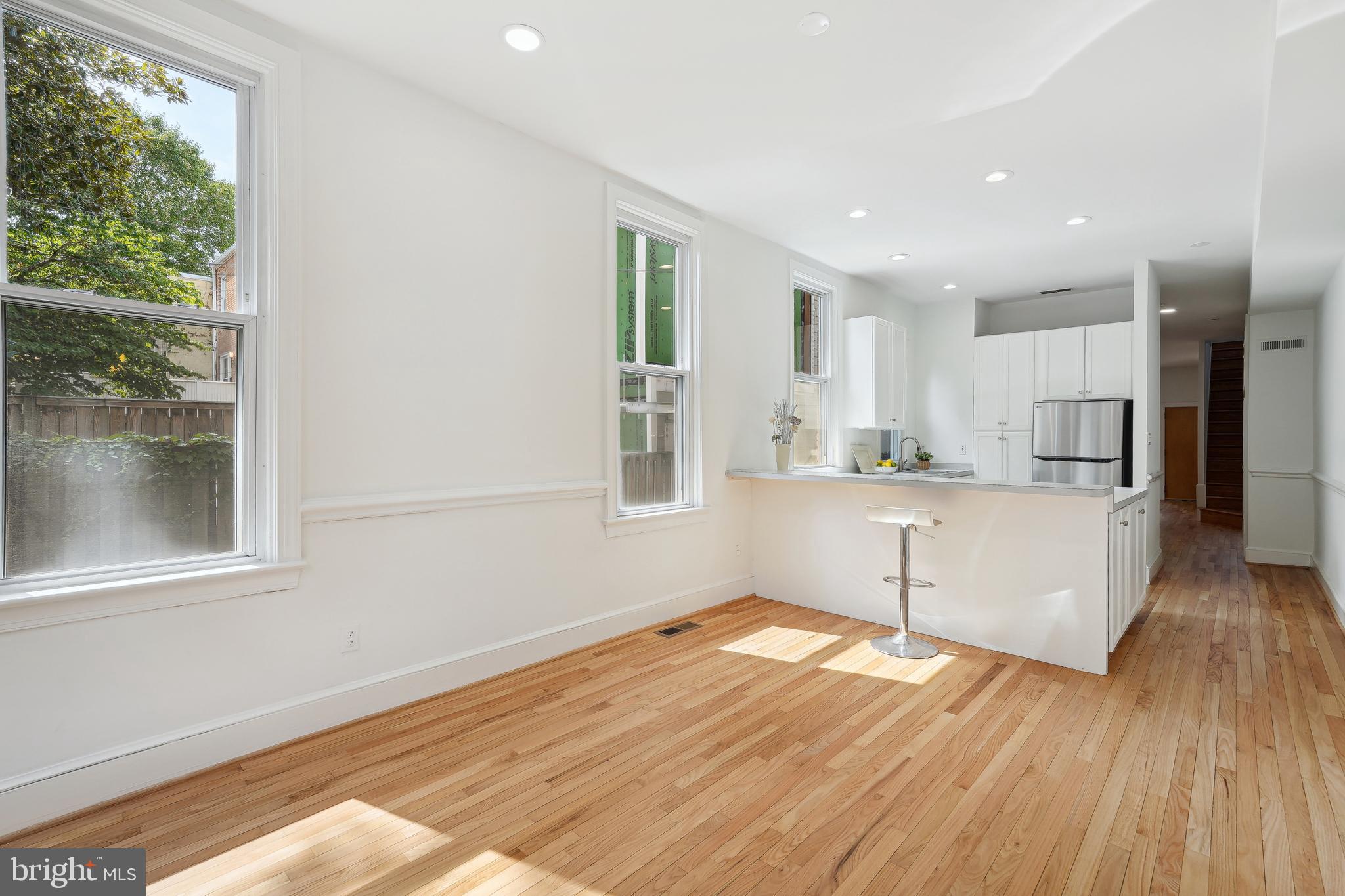 329 Constitution Avenue Northeast Washington, DC 20002 - Photo 23 of 62 a view of a kitchen with wooden floor and a window