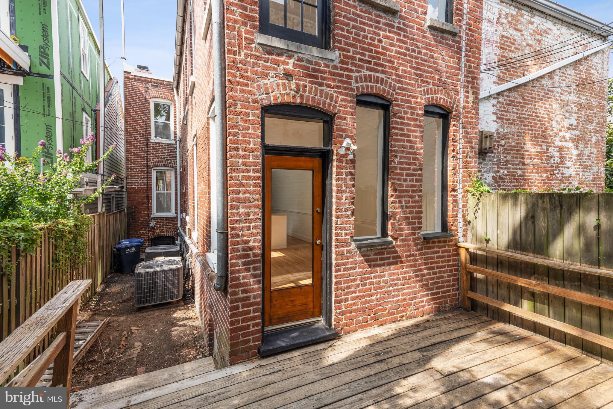 329 Constitution Avenue Northeast Washington, DC 20002 - Photo 40 of 62 a view of a brick house with stairs and wooden floor