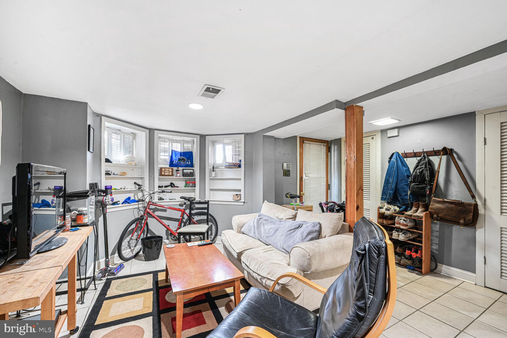 329 Constitution Avenue Northeast Washington, DC 20002 - Photo 46 of 62 a view of a livingroom with furniture and a flat screen tv