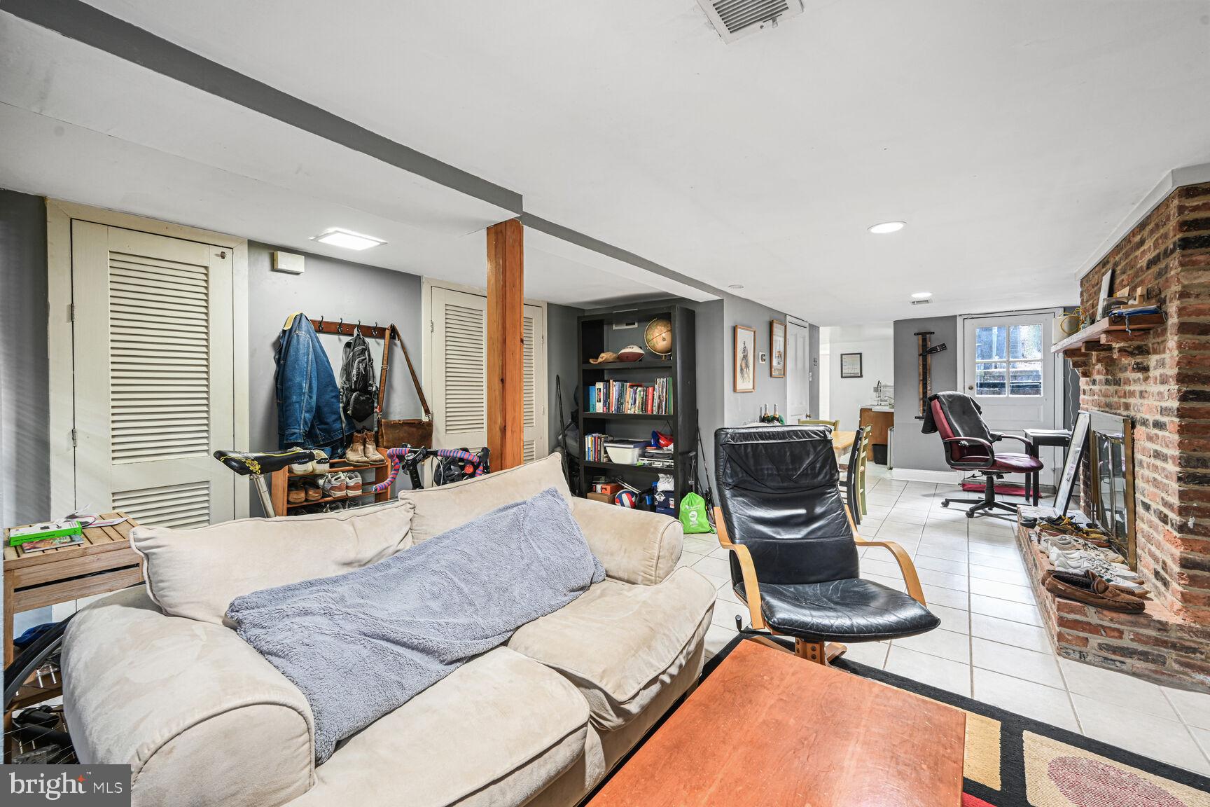 329 Constitution Avenue Northeast Washington, DC 20002 - Photo 47 of 62 a living room with furniture and a flat screen tv
