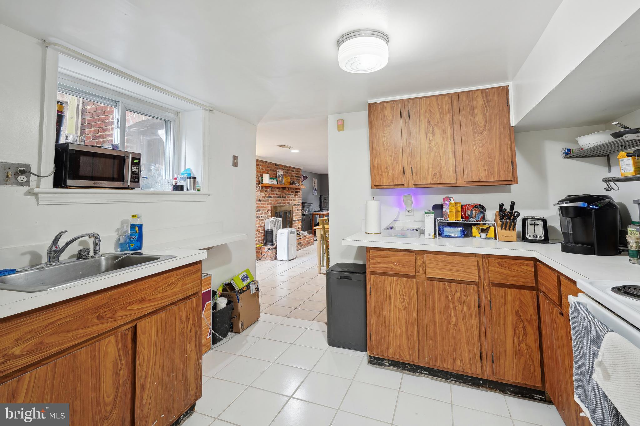 329 Constitution Avenue Northeast Washington, DC 20002 - Photo 52 of 62 a kitchen with stainless steel appliances granite countertop a sink stove and refrigerator