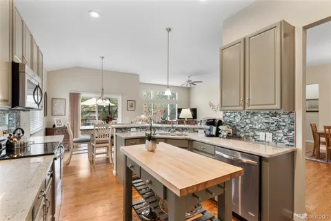 a kitchen with counter top space appliances and cabinets