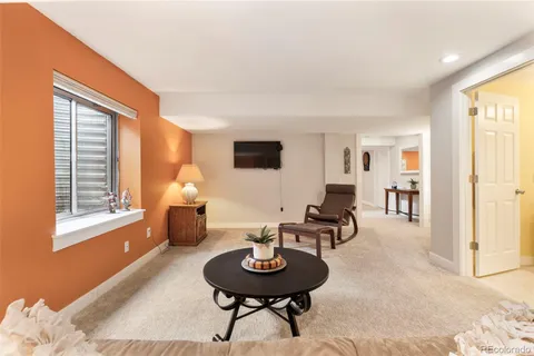 a living room with furniture and a table