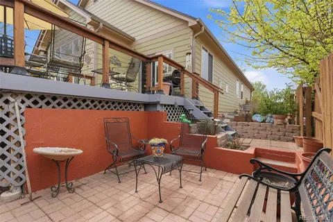 a backyard of a house with outdoor seating