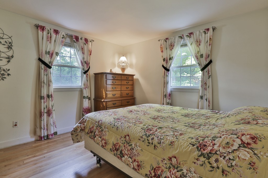 8 Walnut Road Chelmsford, MA 01824 - Photo 18 of 22 a bedroom with a bed and wooden floor