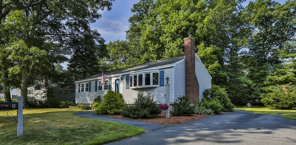 8 Walnut Road Chelmsford, MA 01824 - Photo 22 of 22 a front view of a house with a yard and garage