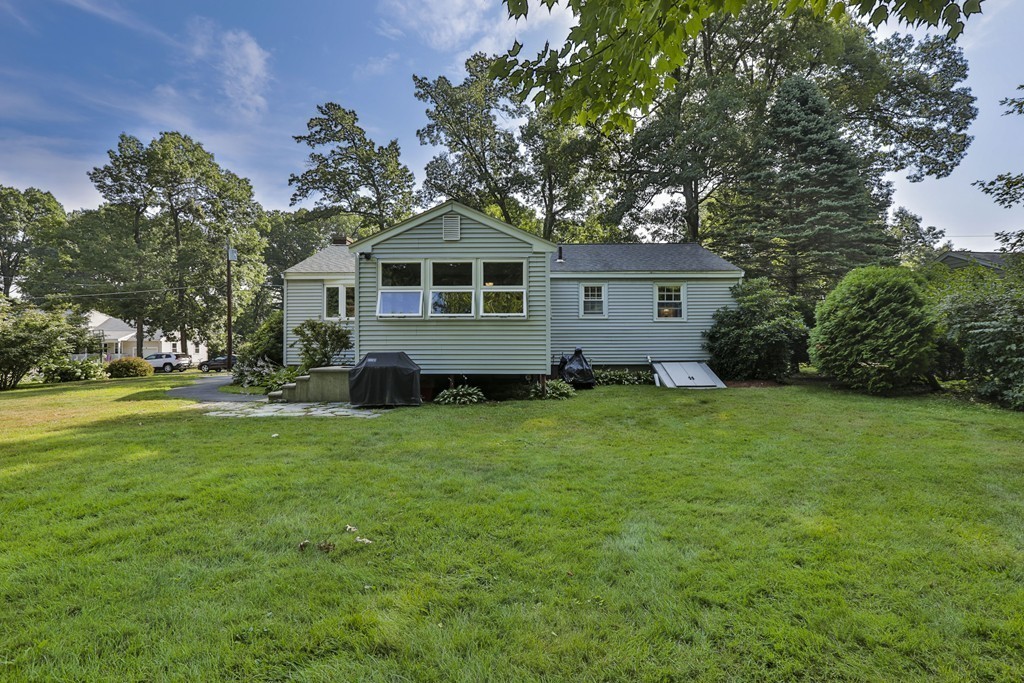 8 Walnut Road Chelmsford, MA 01824 - Photo 4 of 22 a front view of a house with a garden