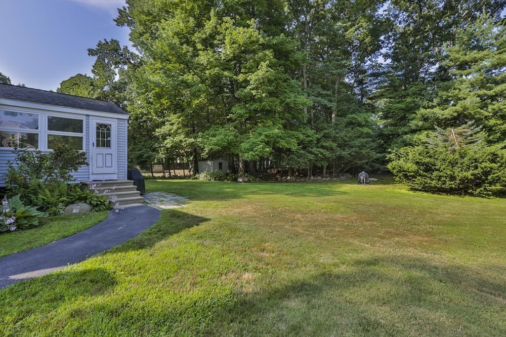8 Walnut Road Chelmsford, MA 01824 - Photo 5 of 22 a view of a house with a yard