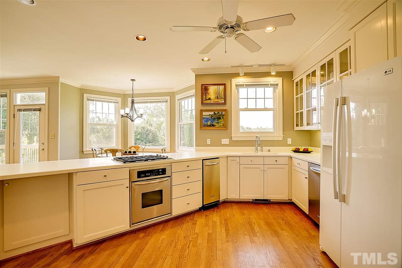 1325 Farmview Road Hillsborough, NC 27278 - Photo 11 of 25 a kitchen with a stove a sink and white appliances