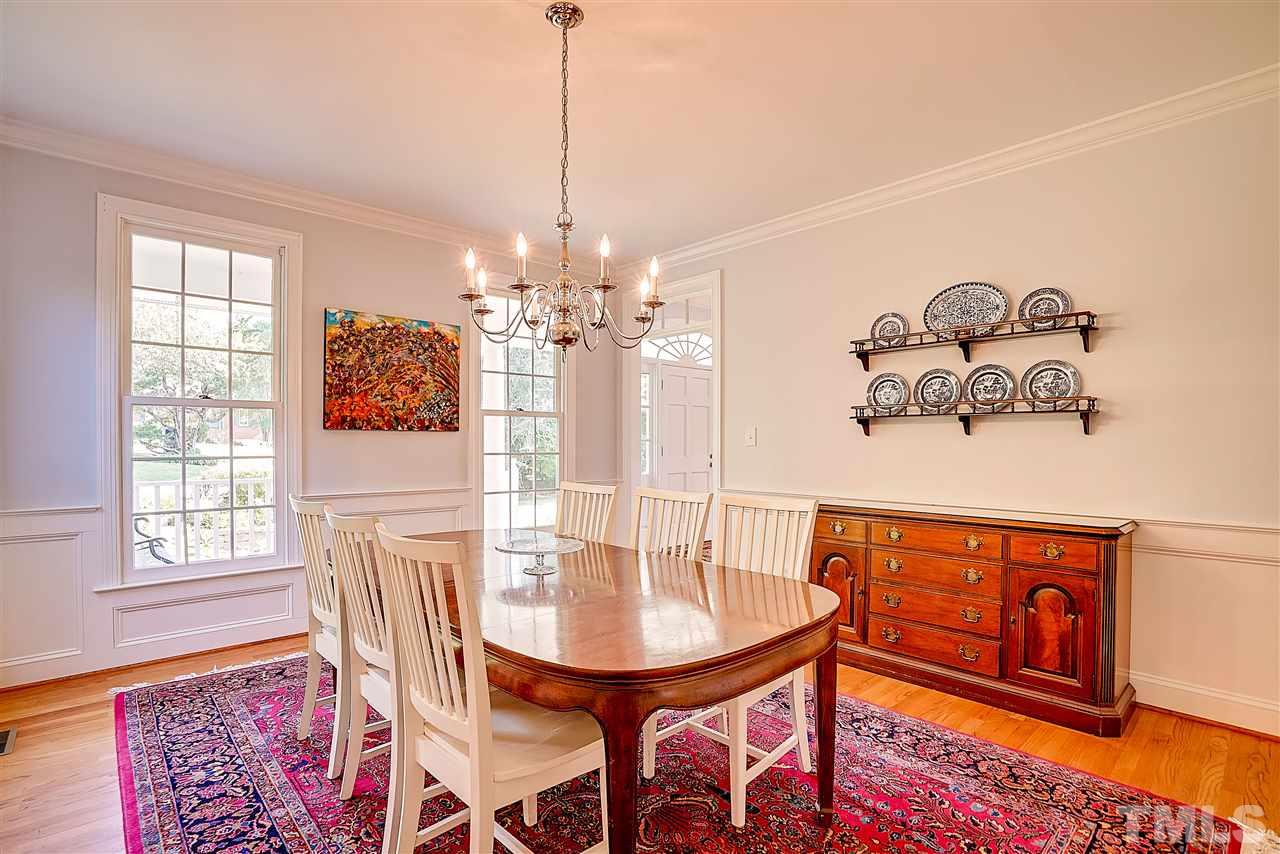 1325 Farmview Road Hillsborough, NC 27278 - Photo 12 of 25 a view of a dining room with furniture window and wooden floor
